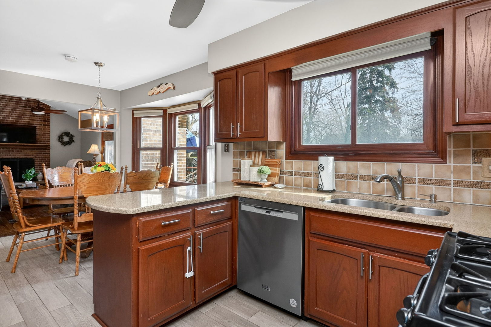 2123 Green Valley Road Darien, IL 60561 - Photo 7 of 30 a kitchen with a sink stove and cabinets
