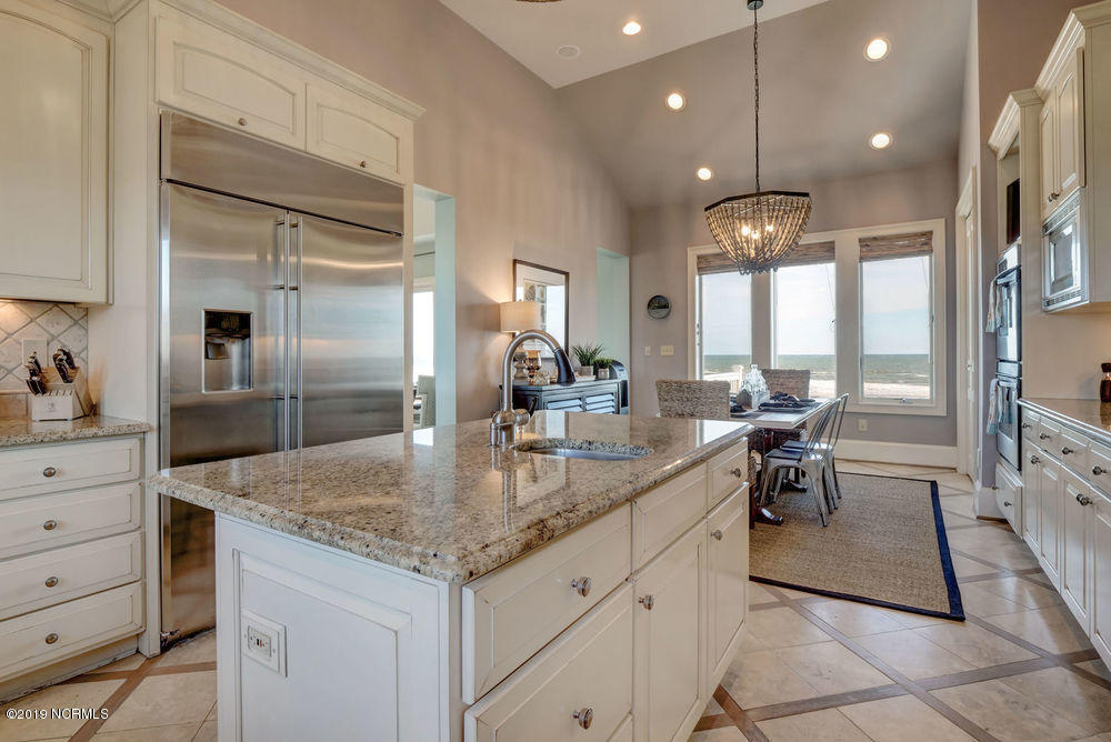 264 Beach Road North Wilmington, NC 28411 - Photo 23 of 51 Gourmet Kitchen on top floor with views to the ocean and sound.