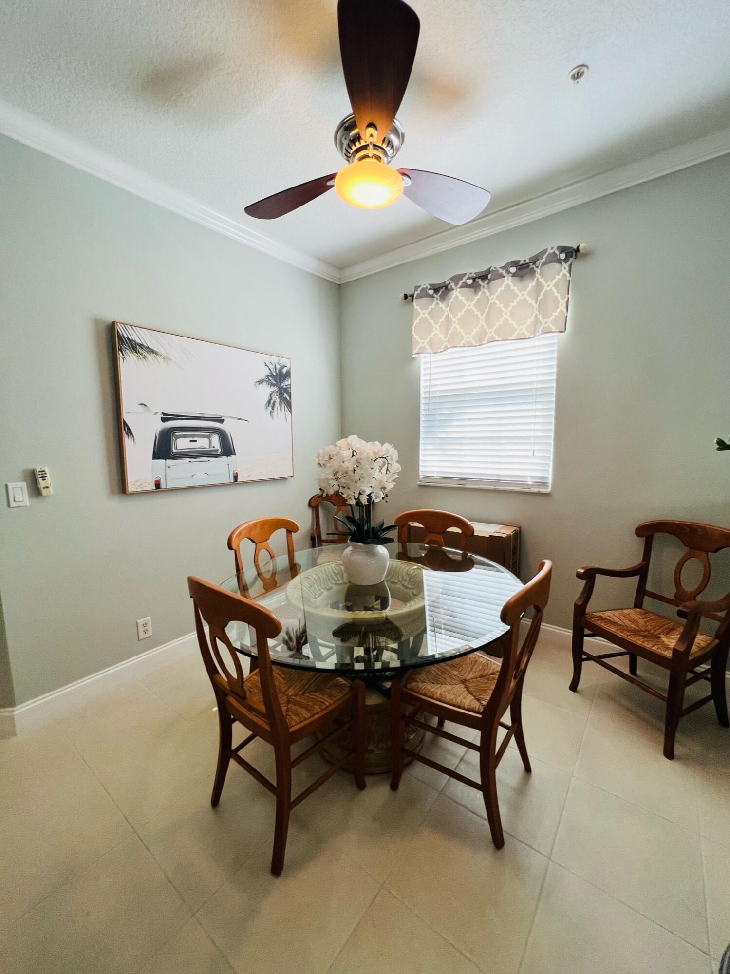 115 Lighthouse Circle, Unit B Tequesta, FL 33469 - Photo 6 of 19 a dining room with furniture and window