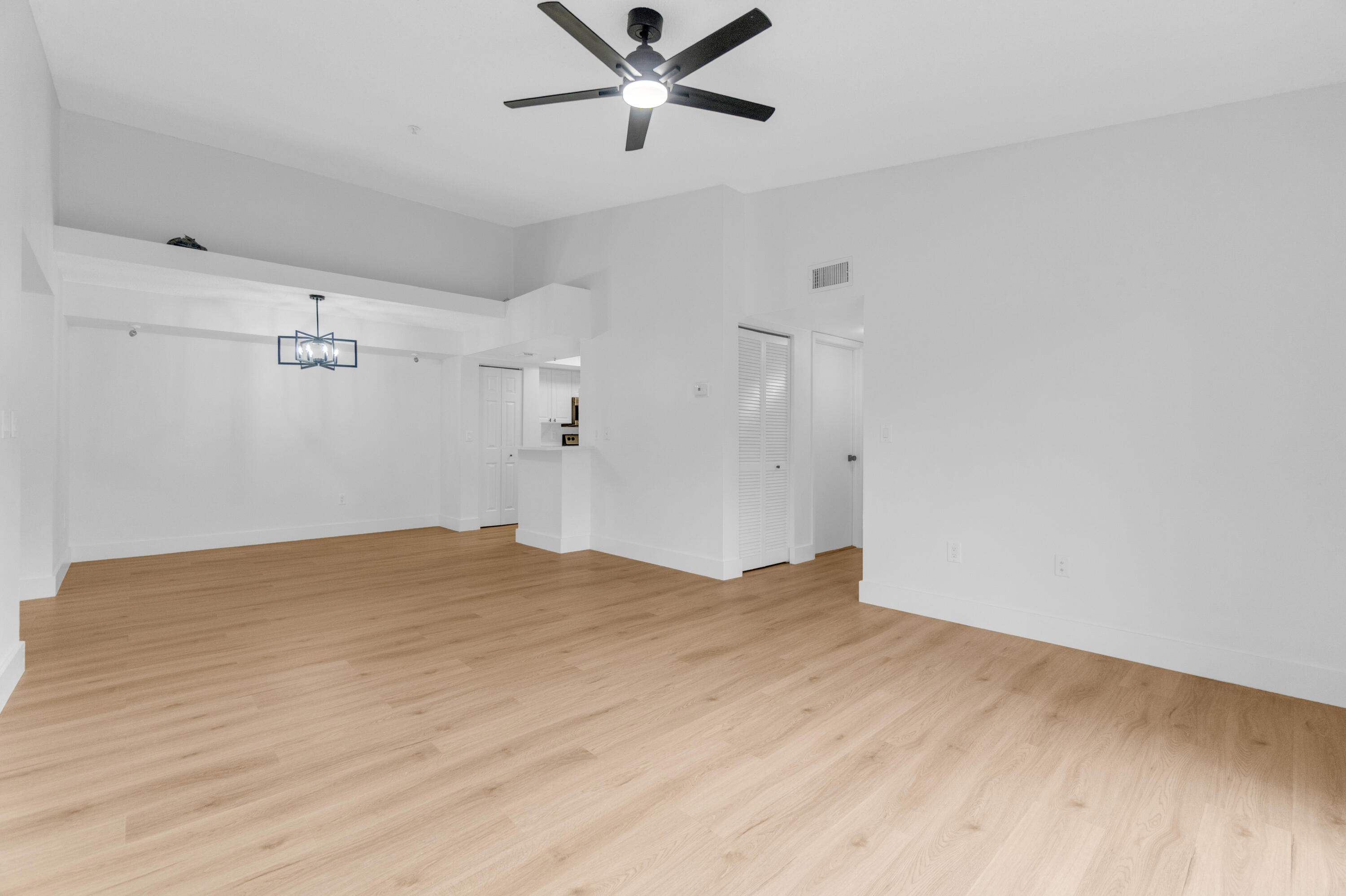 400 Crestwood Court North, Unit 420 Royal Palm Beach, FL 33411 - Photo 12 of 44 a view of empty room with wooden floor