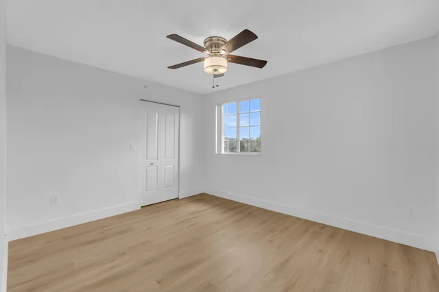 a bathroom with a shower a toilet and a sink