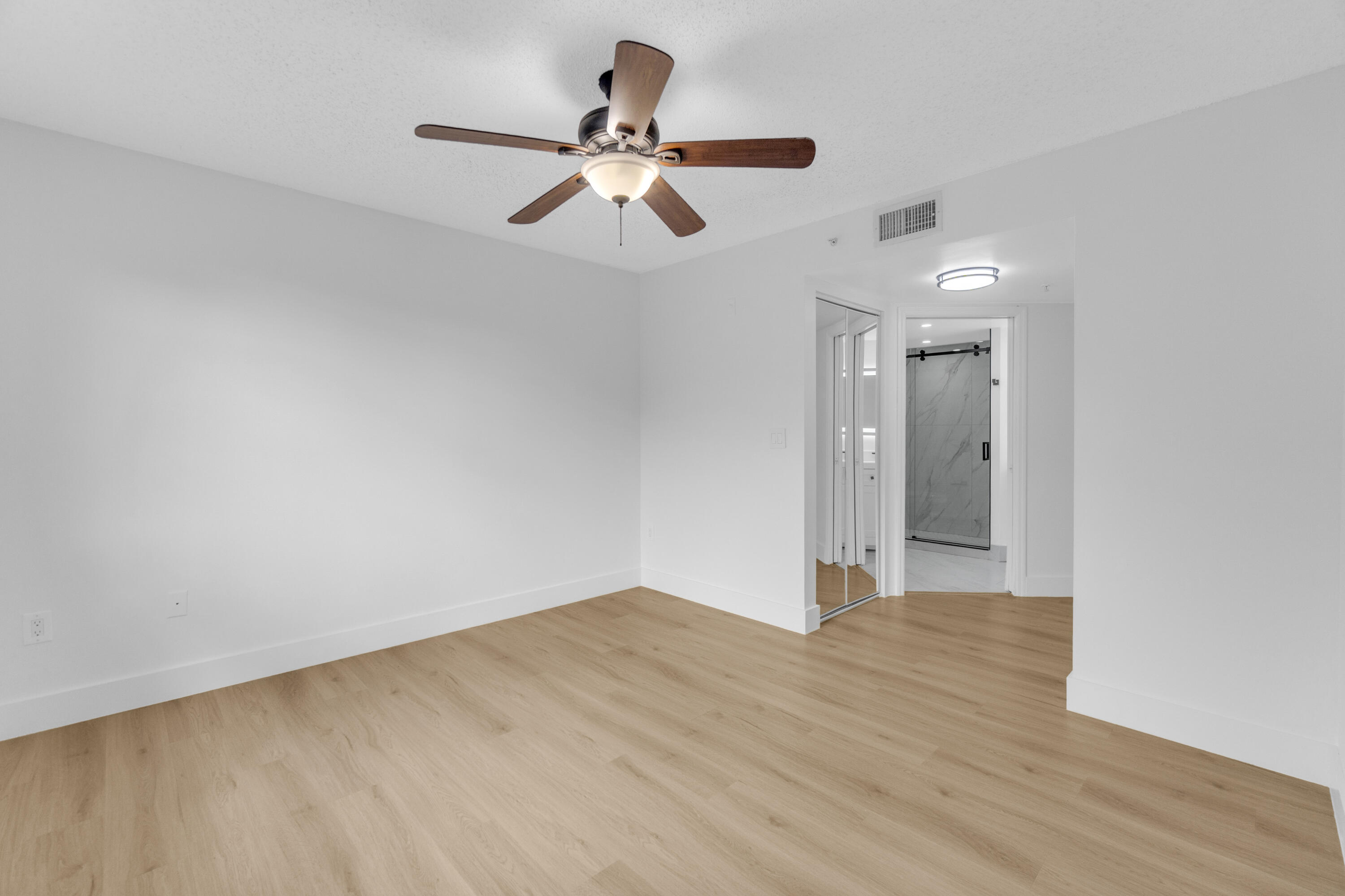 400 Crestwood Court North, Unit 420 Royal Palm Beach, FL 33411 - Photo 26 of 44 a view of an empty room and wooden floor