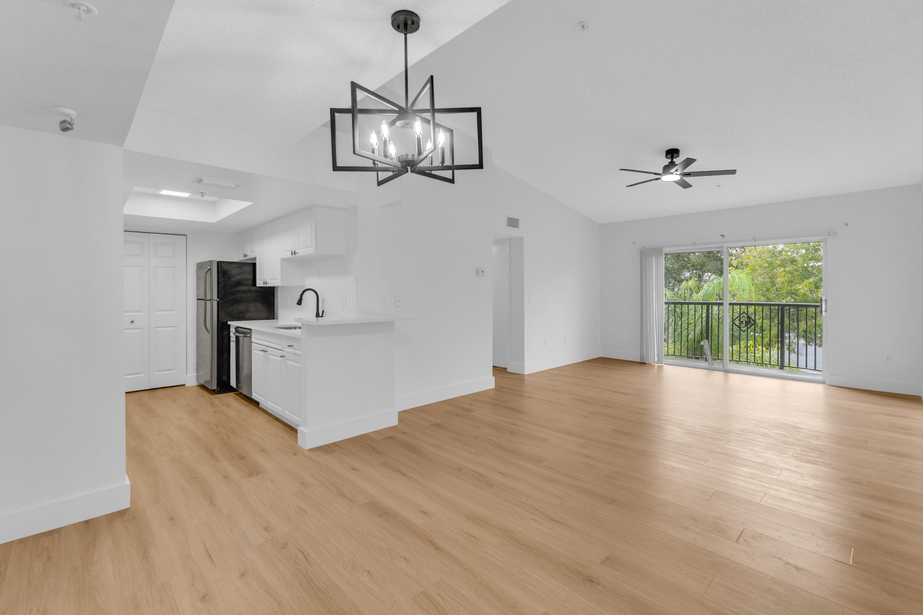 400 Crestwood Court North, Unit 420 Royal Palm Beach, FL 33411 - Photo 29 of 44 wooden floor in an empty room with a window