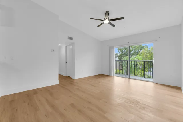 an aerial view of a house with swimming pool and lake view