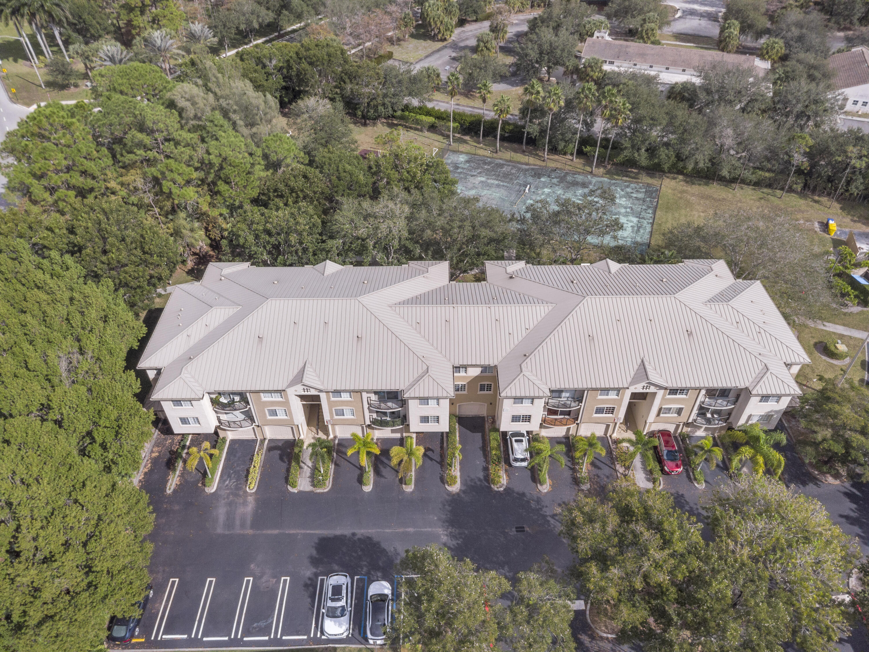 400 Crestwood Court North, Unit 420 Royal Palm Beach, FL 33411 - Photo 36 of 44 an aerial view of a house with swimming pool and lake view