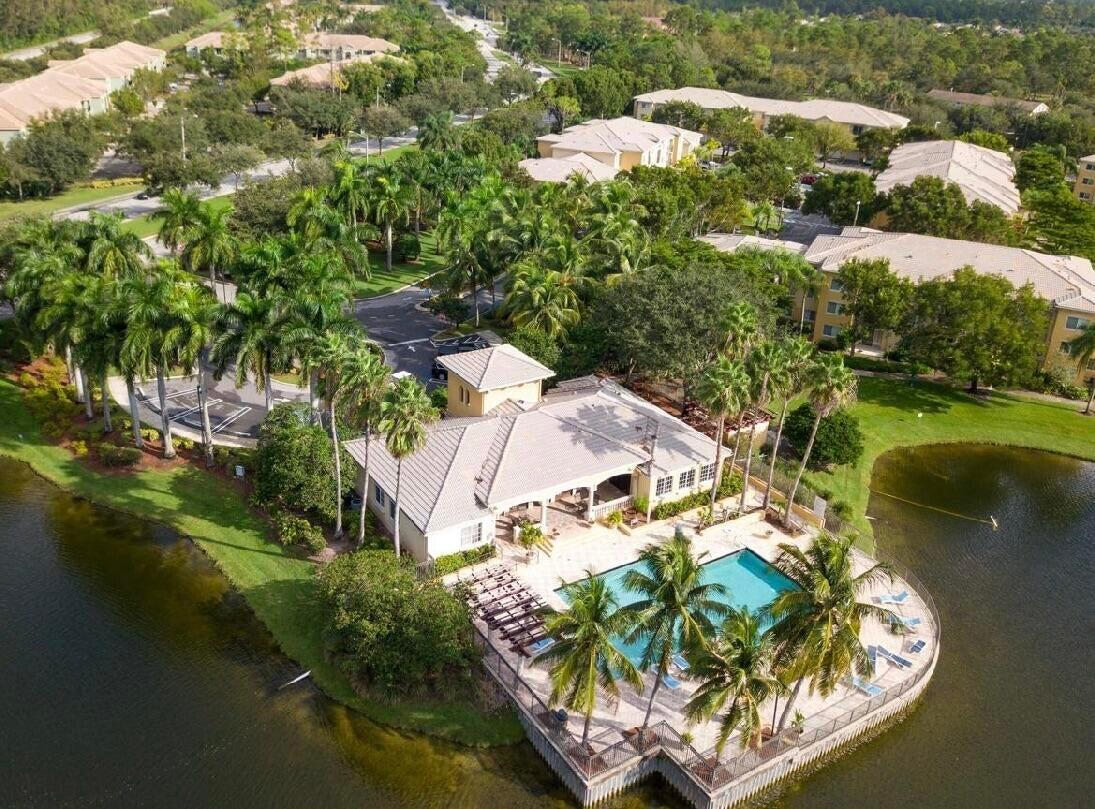 400 Crestwood Court North, Unit 420 Royal Palm Beach, FL 33411 - Photo 38 of 44 an aerial view of residential house with outdoor space and lake view