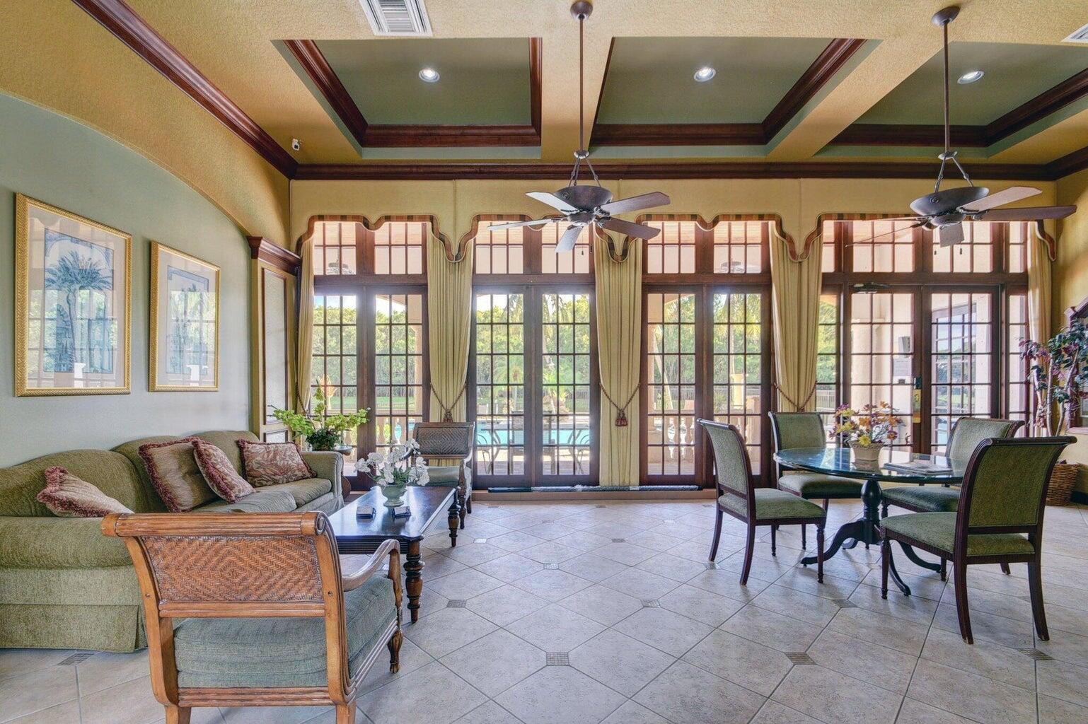 400 Crestwood Court North, Unit 420 Royal Palm Beach, FL 33411 - Photo 40 of 44 a living room with furniture and a large window