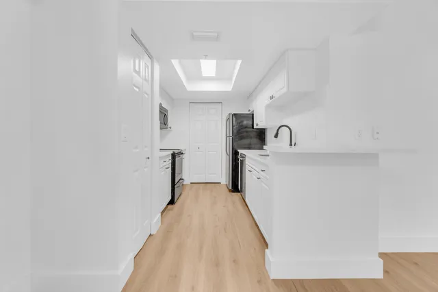 a kitchen with a stove and a microwave