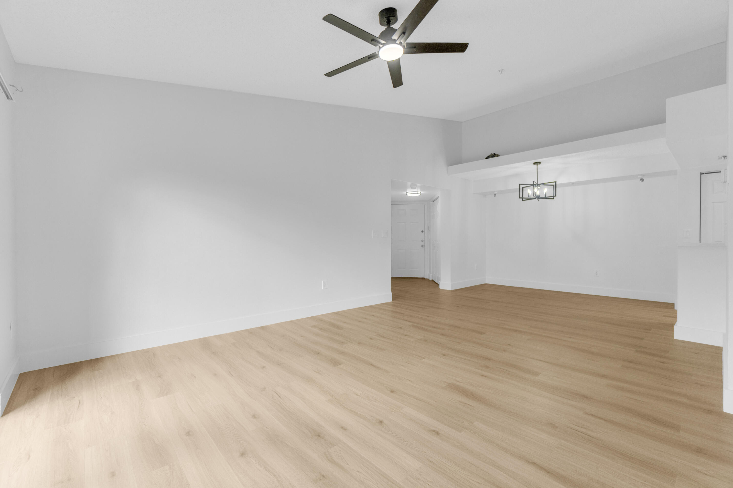 400 Crestwood Court North, Unit 420 Royal Palm Beach, FL 33411 - Photo 10 of 44 a view of empty room with wooden floor