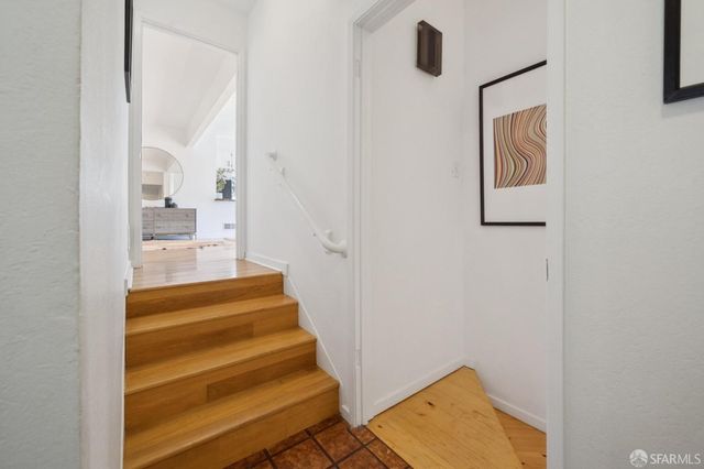 a view of staircase with white walls