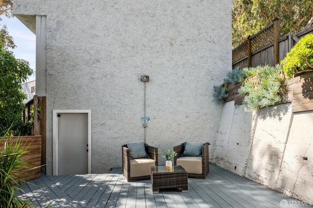 a view of a house with backyard and sitting area