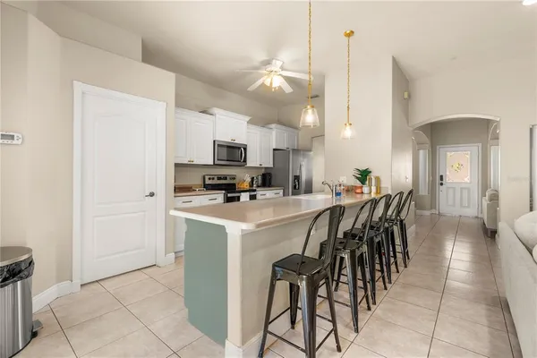a view of kitchen with cabinets and wooden floor