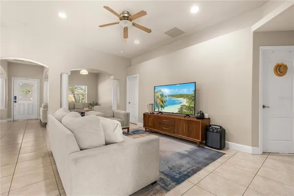 a living room with furniture and a flat screen tv