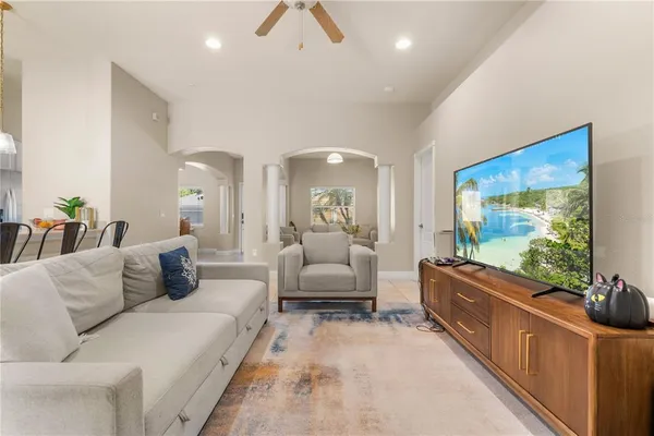a living room with furniture and a flat screen tv