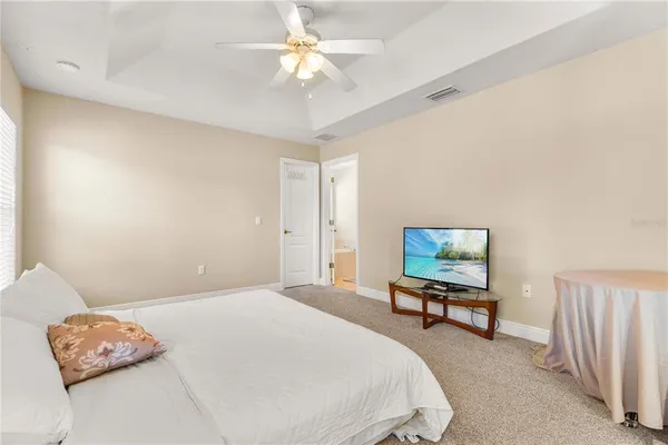 a bedroom with a bed dresser and a window