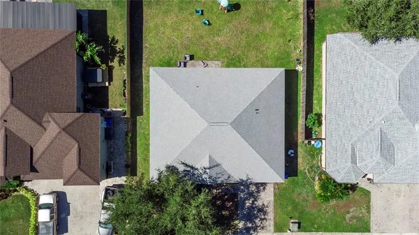 an aerial view of a house having yard