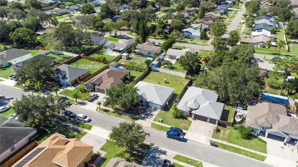 an aerial view of residential houses with outdoor space
