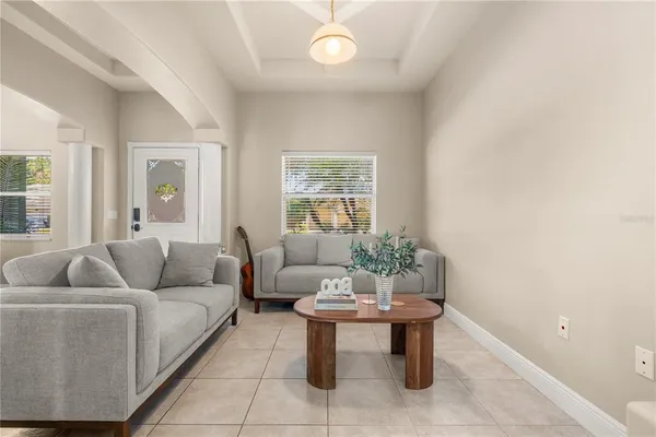 a living room with furniture and a large window