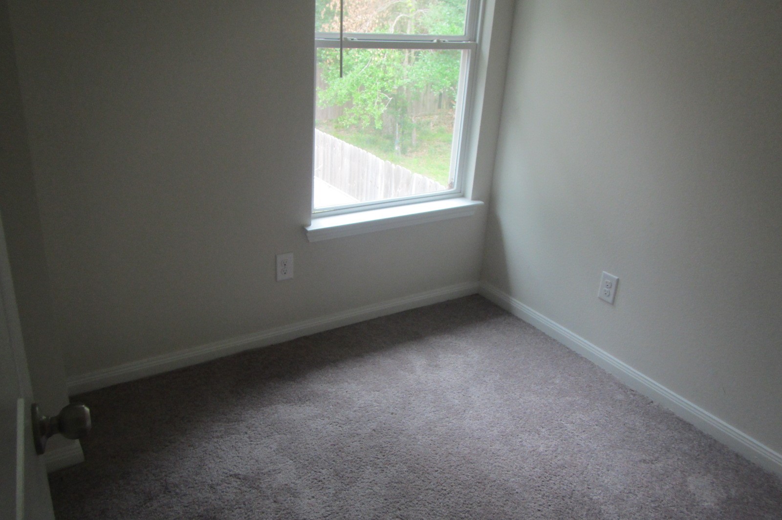 28612 Netawake Court Point Blank, TX 77364 - Photo 11 of 14 an empty room with a window