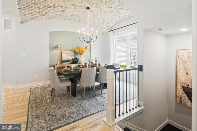 a kitchen with stainless steel appliances a stove microwave and cabinets