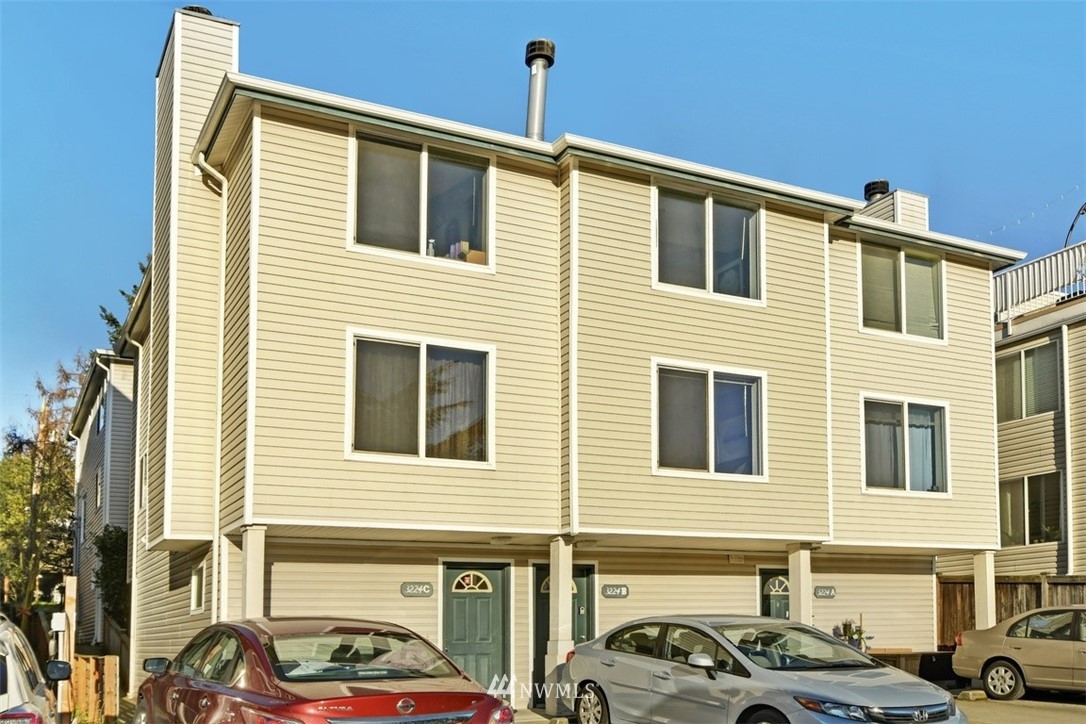 a front view of a building with parking space