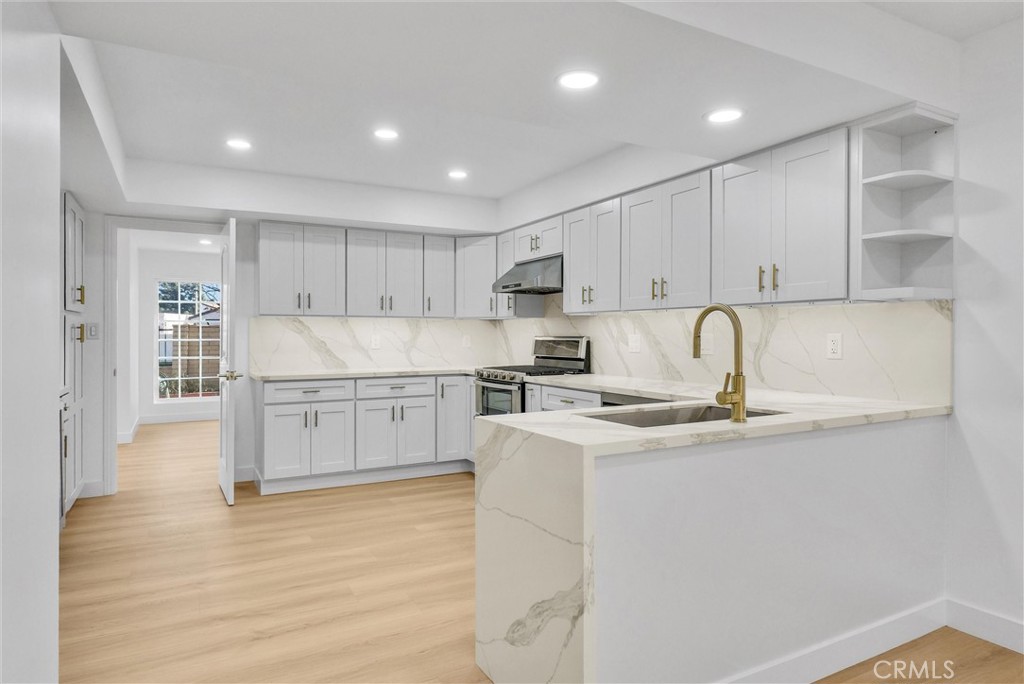 18 Meadowsweet Way Irvine, CA 92612 - Photo 12 of 66 a kitchen with stainless steel appliances granite countertop a sink and cabinets