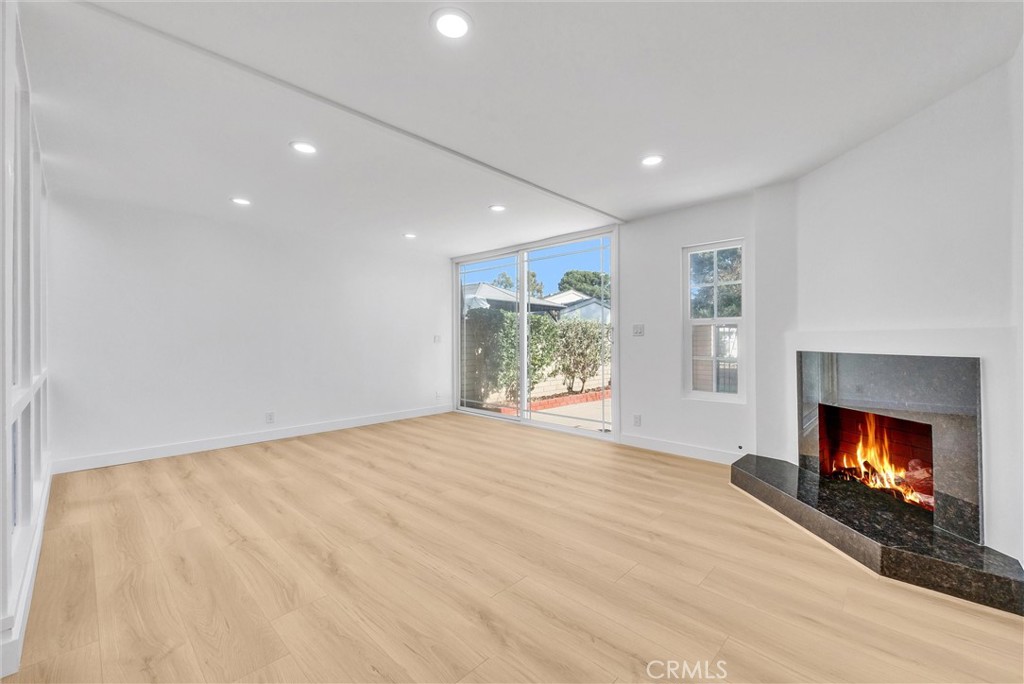 18 Meadowsweet Way Irvine, CA 92612 - Photo 21 of 66 a view of an empty room with a fireplace and a window
