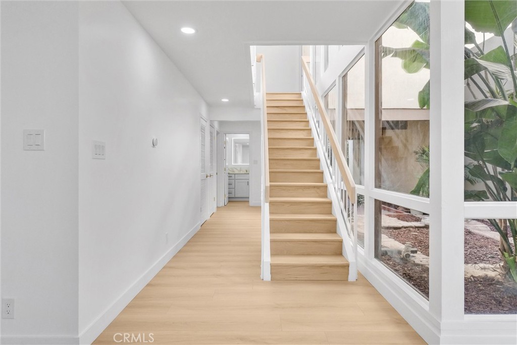 18 Meadowsweet Way Irvine, CA 92612 - Photo 24 of 66 a view of staircase with lots of windows and white walls