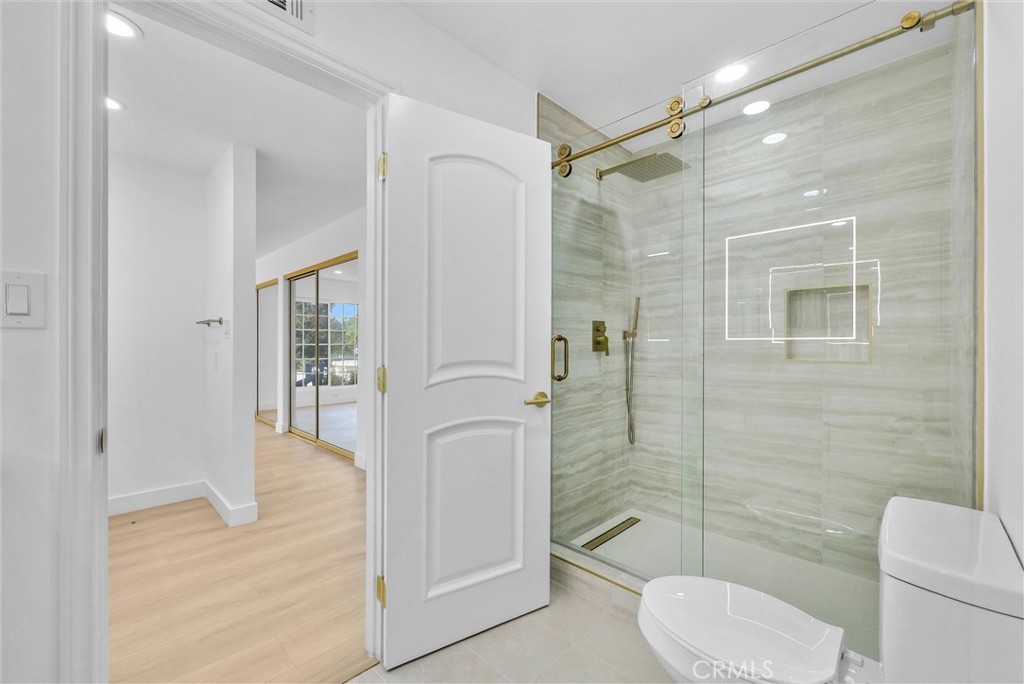 18 Meadowsweet Way Irvine, CA 92612 - Photo 33 of 66 a bathroom with a toilet shower vanity and a sink