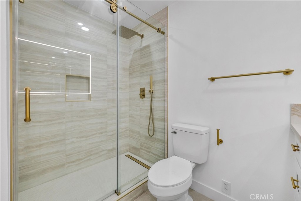 18 Meadowsweet Way Irvine, CA 92612 - Photo 42 of 66 a bathroom with a toilet and shower