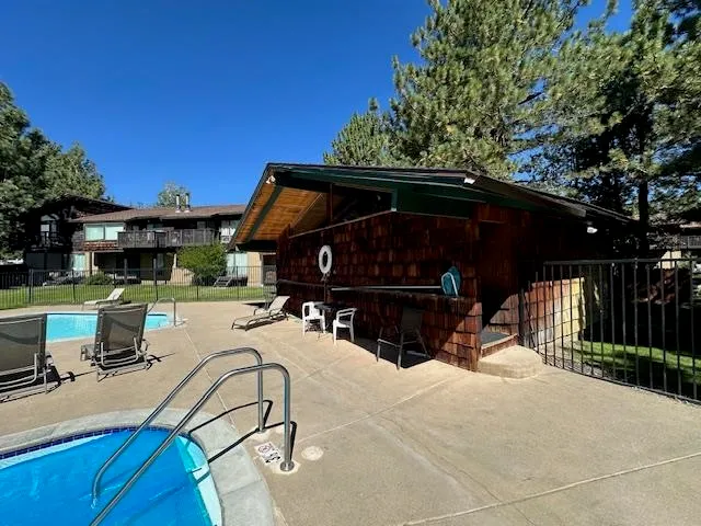 a view of a swimming pool with a patio