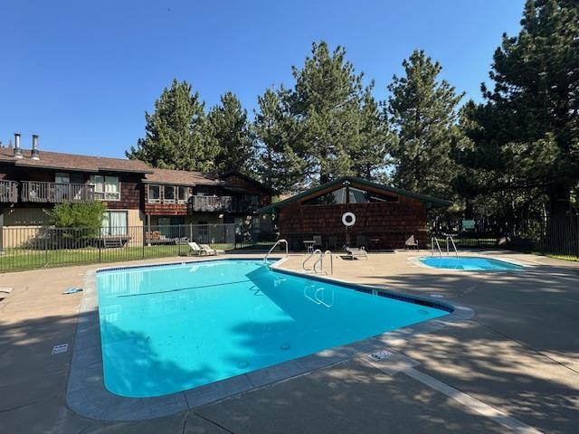 3199 Chateau Road, Unit 17 Mammoth Lakes, CA 93546 - Photo 21 of 23 a view of a swimming pool with chair and tables