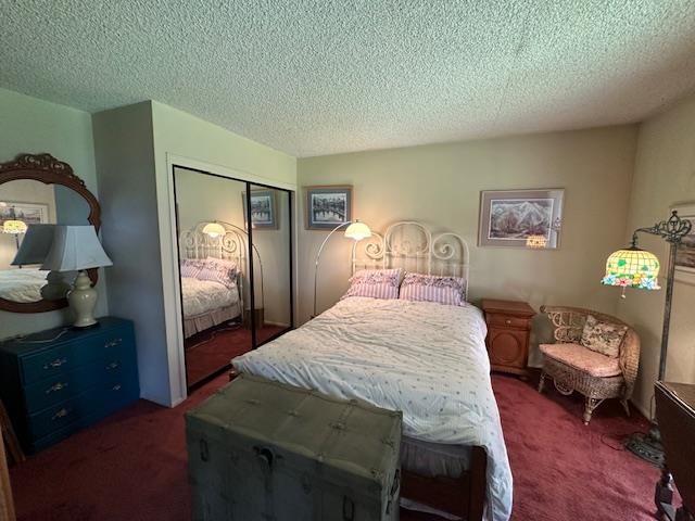 3199 Chateau Road, Unit 17 Mammoth Lakes, CA 93546 - Photo 9 of 23 a bedroom with a bed and a chandelier