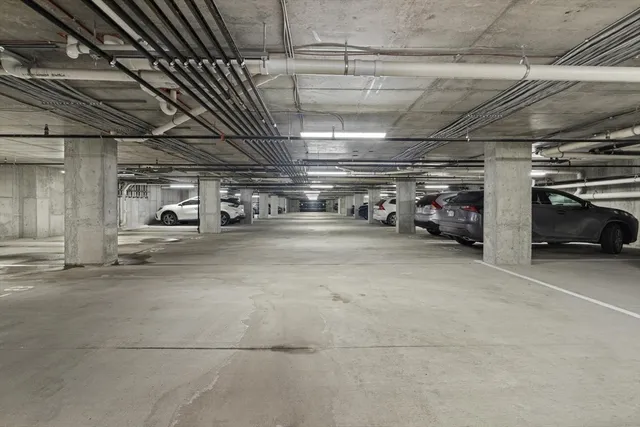 a view of parking garage with cars
