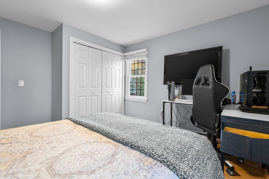 83 Dolar Davis Road Barnstable, MA 02632 - Photo 12 of 36 a bedroom with a bed and a television