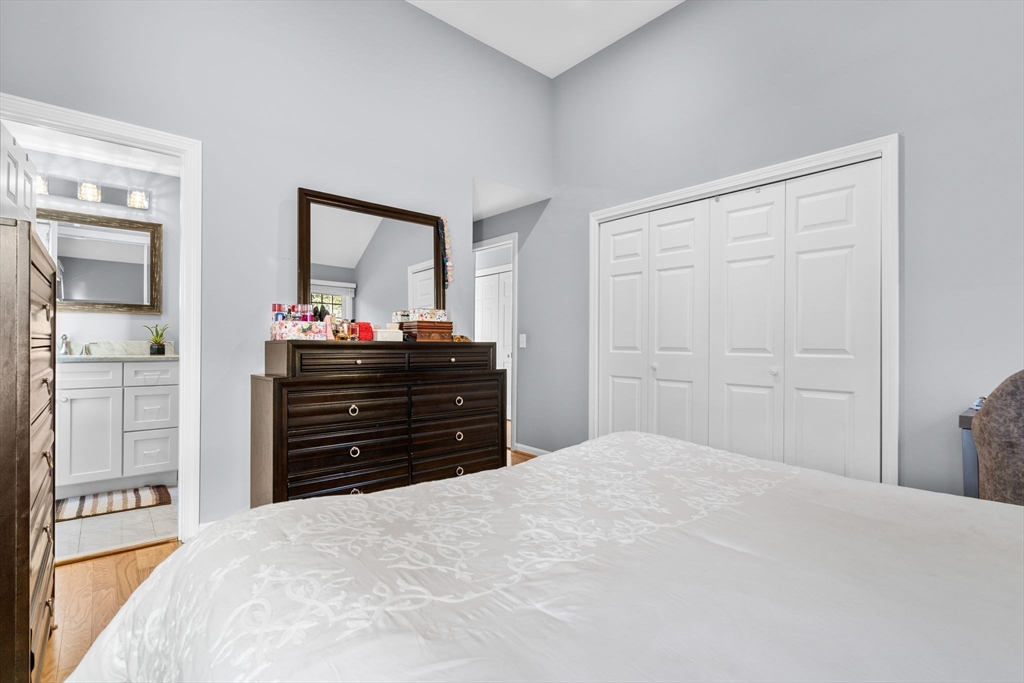 83 Dolar Davis Road Barnstable, MA 02632 - Photo 15 of 36 a bedroom with a bed and a dresser