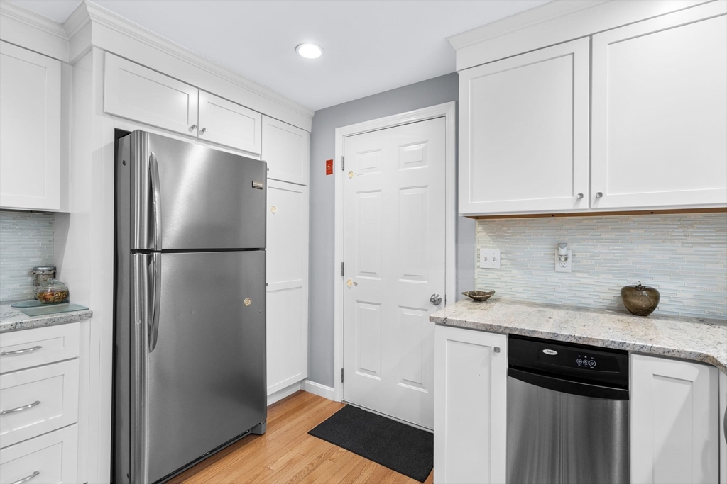 83 Dolar Davis Road Barnstable, MA 02632 - Photo 17 of 36 a kitchen with a refrigerator and cabinets