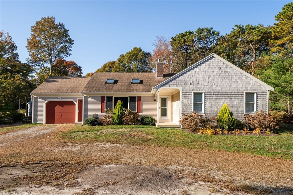 83 Dolar Davis Road Barnstable, MA 02632 - Photo 24 of 36 a front view of a house with garden