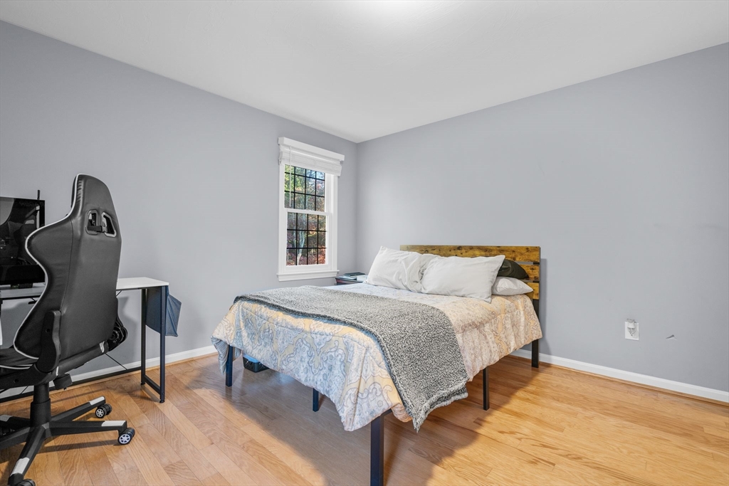 83 Dolar Davis Road Barnstable, MA 02632 - Photo 27 of 36 a bedroom with a bed a chair and a window