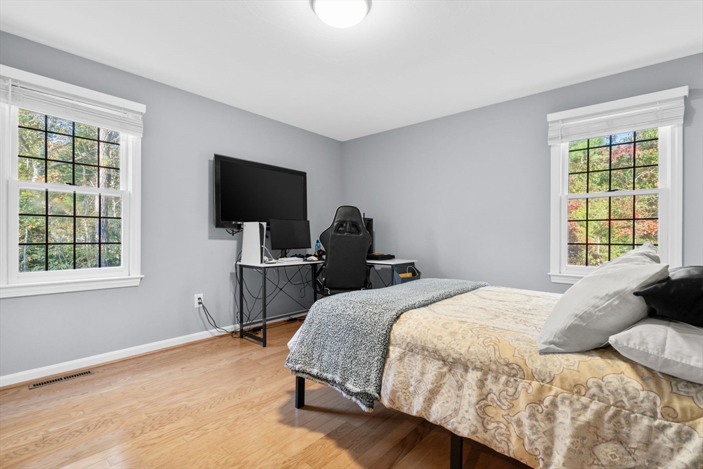 83 Dolar Davis Road Barnstable, MA 02632 - Photo 33 of 36 a bedroom with a bed tv and a window