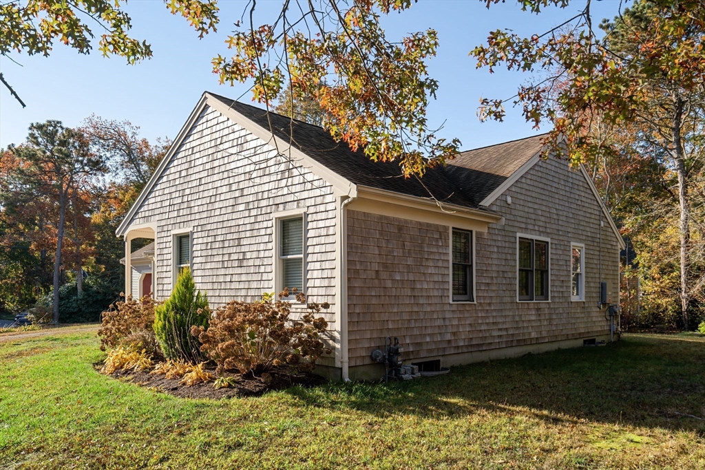 83 Dolar Davis Road Barnstable, MA 02632 - Photo 7 of 36 a view of a house with a yard