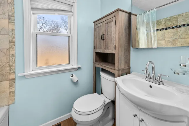a bathroom with a sink and shower