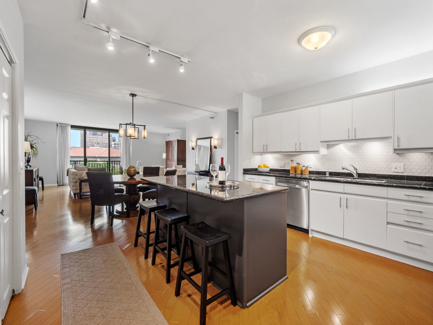 55 West Delaware Place, Unit 921 Chicago, IL 60610 - Photo 12 of 33 a kitchen with lots of counter top space and dining table