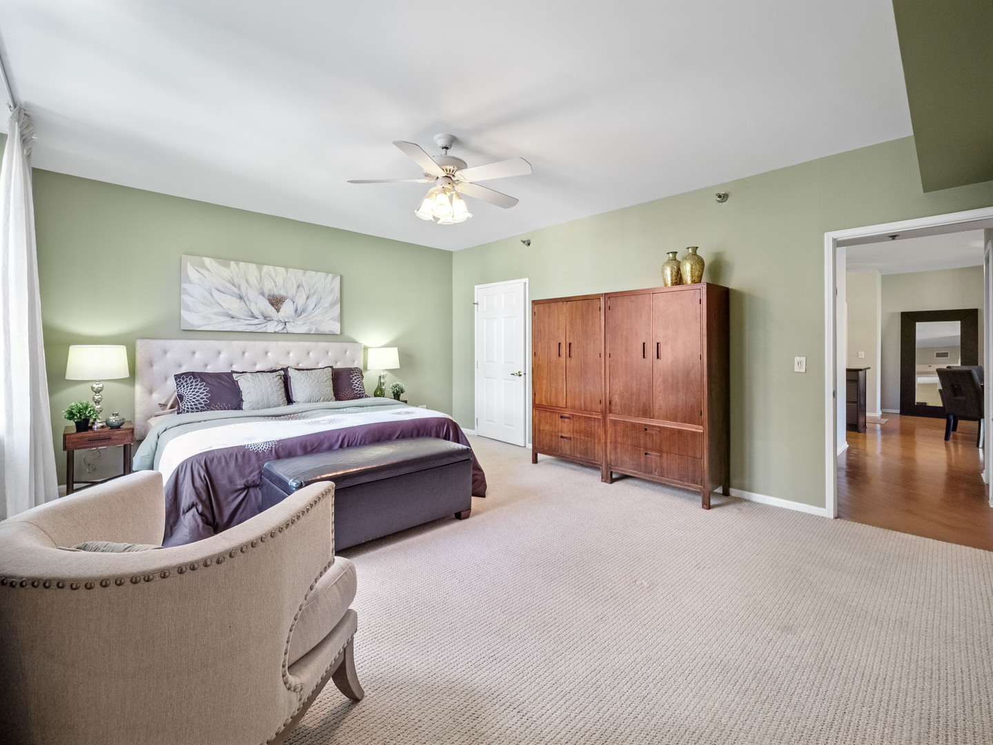 55 West Delaware Place, Unit 921 Chicago, IL 60610 - Photo 14 of 33 a spacious bedroom with a bed and a chandelier