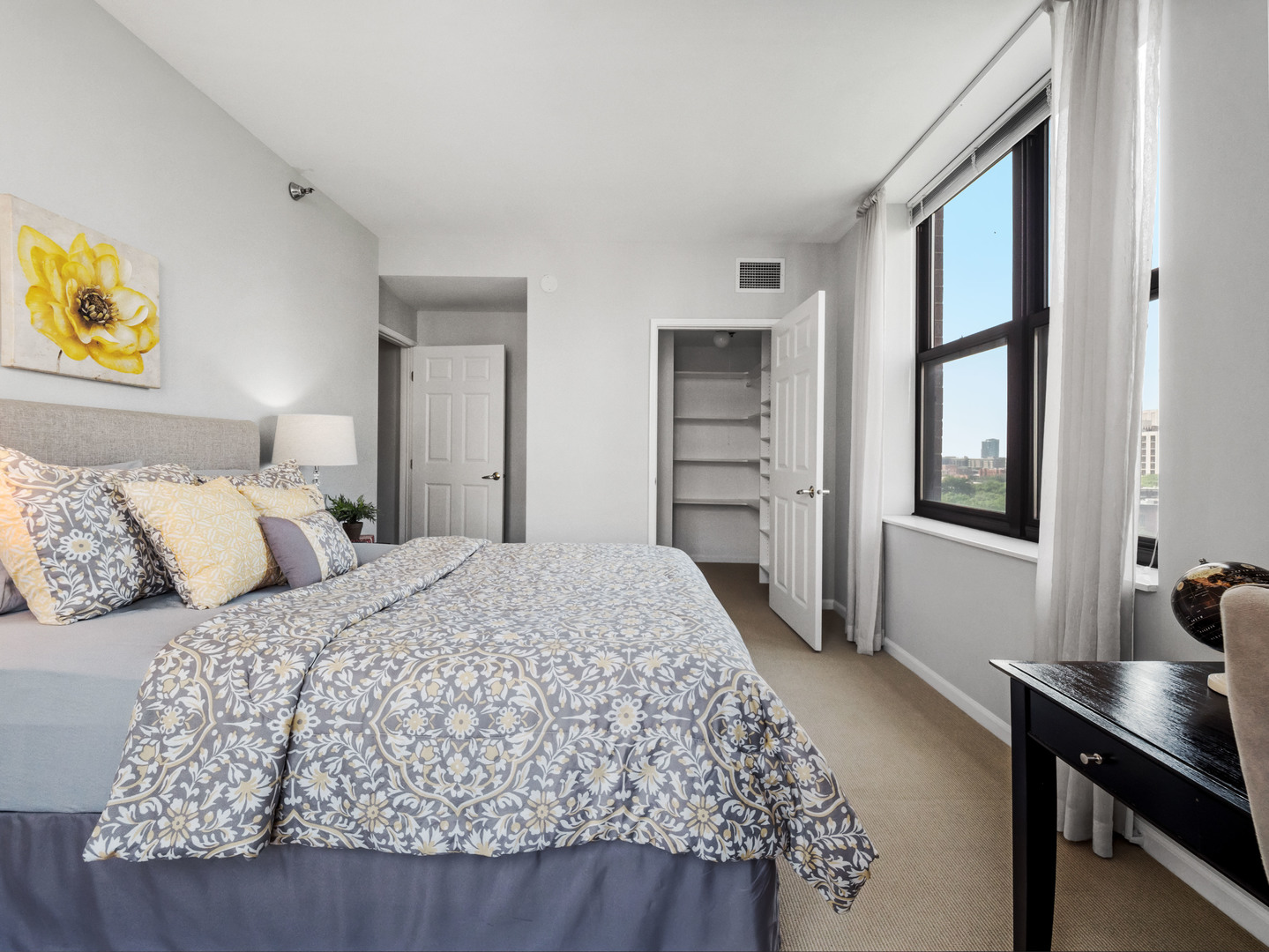 55 West Delaware Place, Unit 921 Chicago, IL 60610 - Photo 18 of 33 a bedroom with a large bed and a window