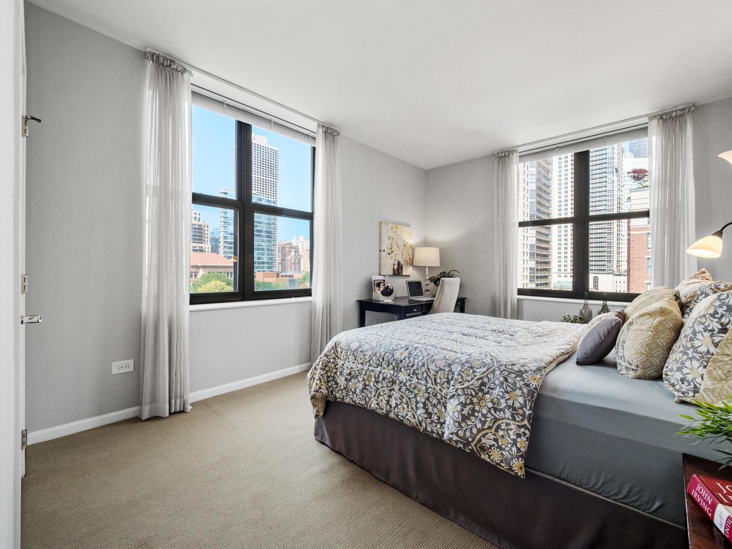 55 West Delaware Place, Unit 921 Chicago, IL 60610 - Photo 19 of 33 a bedroom with a bed and a window