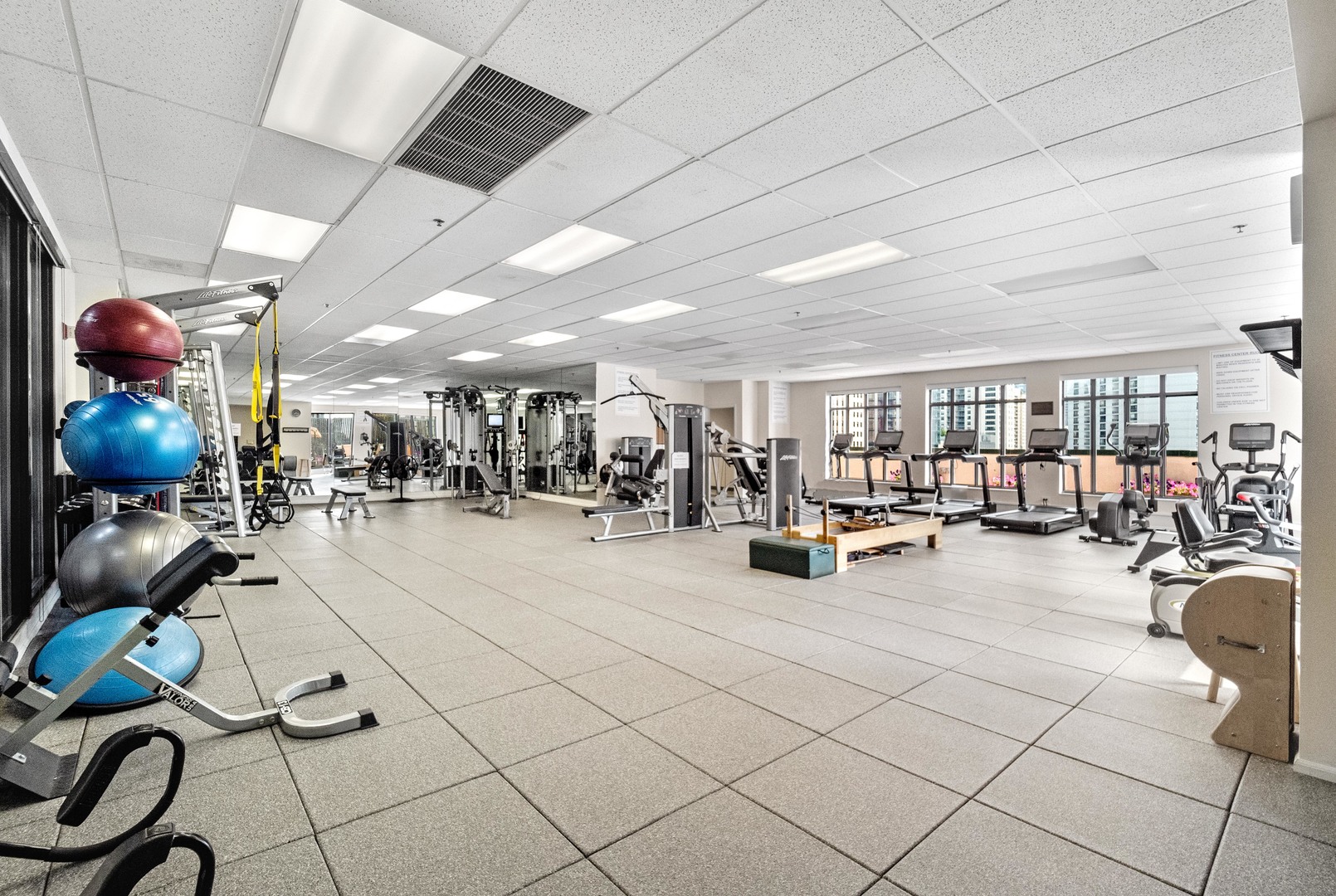 55 West Delaware Place, Unit 921 Chicago, IL 60610 - Photo 24 of 33 a room with lots of furniture and white equipment