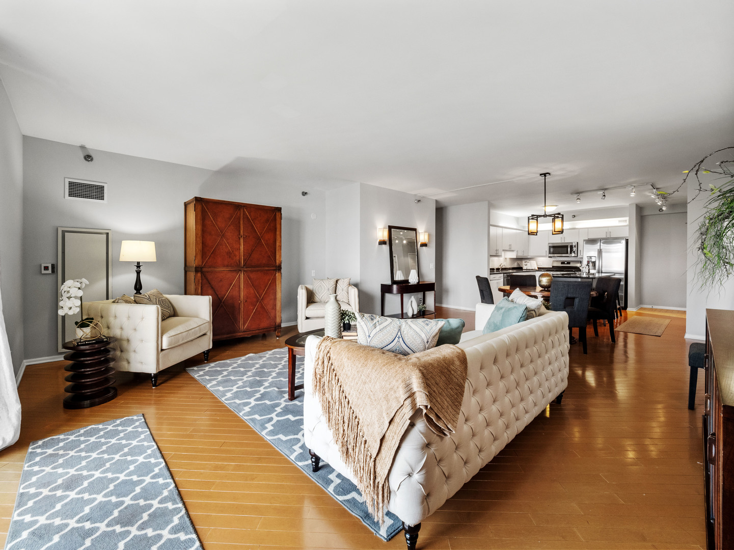 55 West Delaware Place, Unit 921 Chicago, IL 60610 - Photo 6 of 33 a living room with furniture and a chandelier
