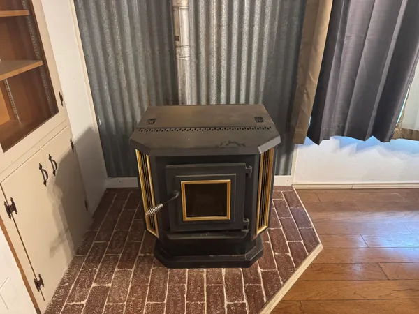 a stove top oven sitting inside of a kitchen
