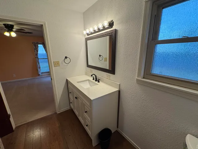a bathroom with a double vanity sink and mirror